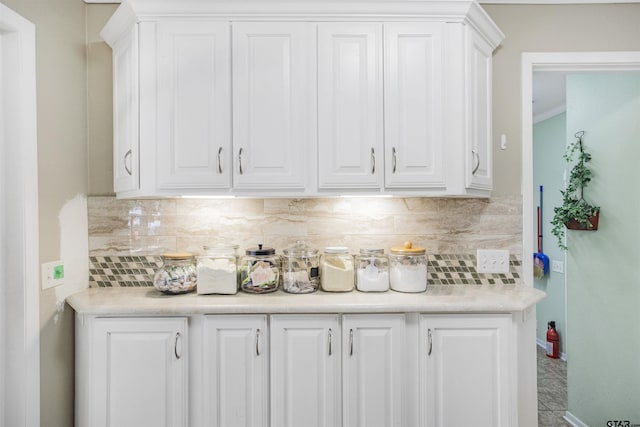 18058 Whispering Pines Rd, Flint, TX 75762 - kitchen with white cabinetry, light countertops, and backsplash