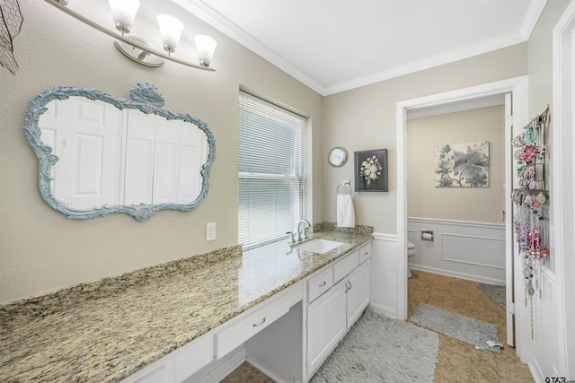 18058 Whispering Pines Rd, Flint, TX 75762 - bathroom featuring vanity, ornamental molding, a wainscoted wall, and tile patterned floors