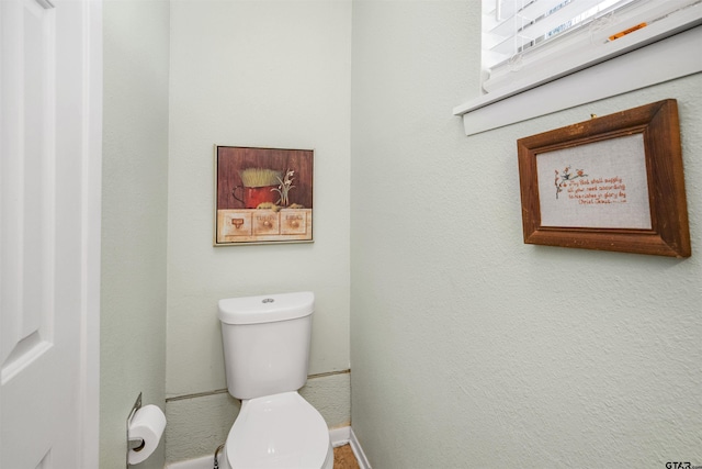 18058 Whispering Pines Rd, Flint, TX 75762 - bathroom with toilet and baseboards