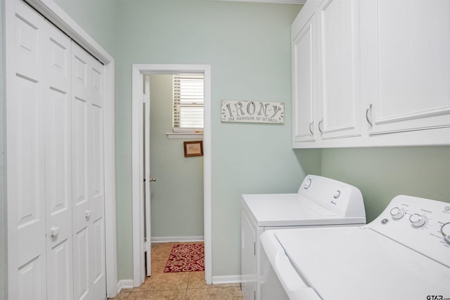18058 Whispering Pines Rd, Flint, TX 75762 - washroom with washing machine and clothes dryer, cabinet space, and light tile patterned floors