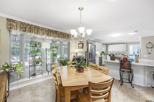 18058 Whispering Pines Rd, Flint, TX 75762 - dining room featuring crown molding, a chandelier, and light tile patterned floors