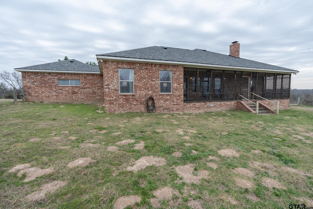 rear view of house with a lawn