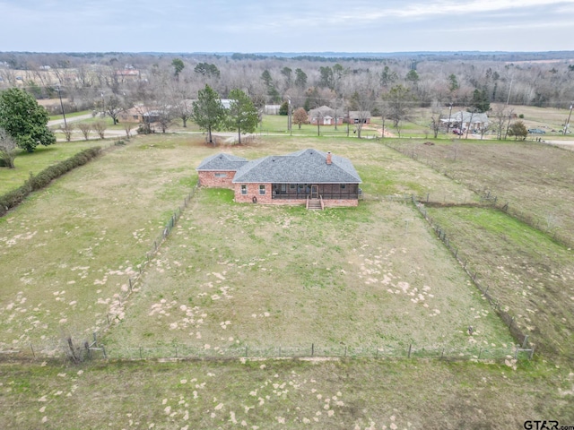 birds eye view of property with a rural view