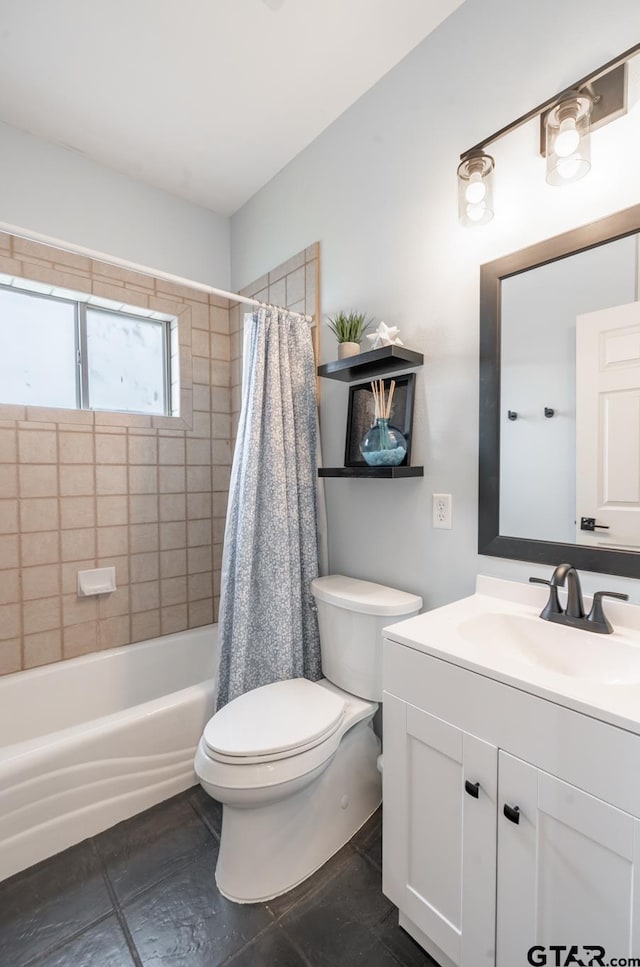 full bathroom with vanity, shower / tub combo, and toilet