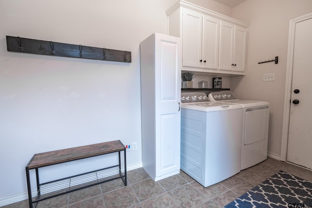 laundry room with cabinets and separate washer and dryer