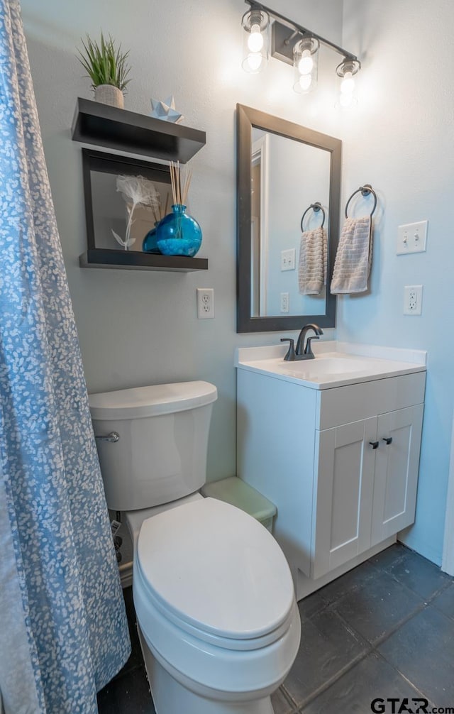 bathroom with vanity and toilet