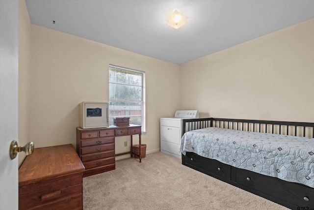 bedroom featuring light wood-type flooring and washer / clothes dryer