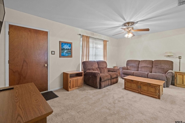 living room with light carpet and ceiling fan