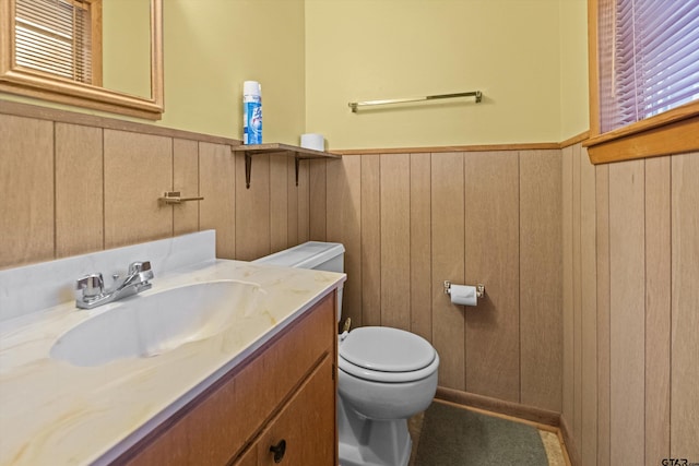 bathroom featuring toilet and vanity