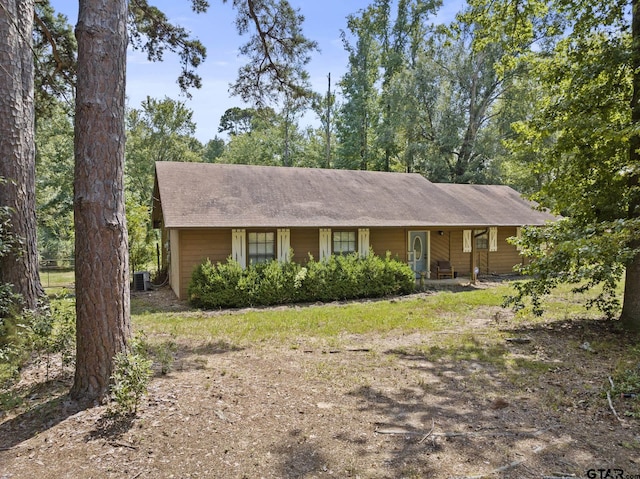 ranch-style house featuring central AC unit