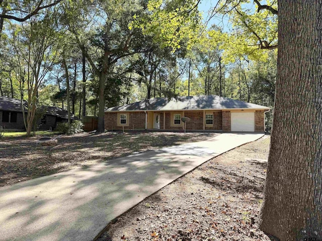 ranch-style home featuring a garage