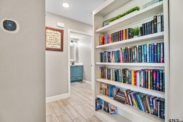 217 Meadow Ln, Lindale, TX 75771 - corridor featuring baseboards and a sink