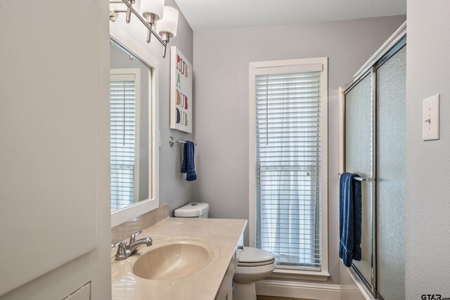 2600 Boldt Ave, Tyler, TX 75701 - bathroom featuring vanity, a shower with door, and plenty of natural light