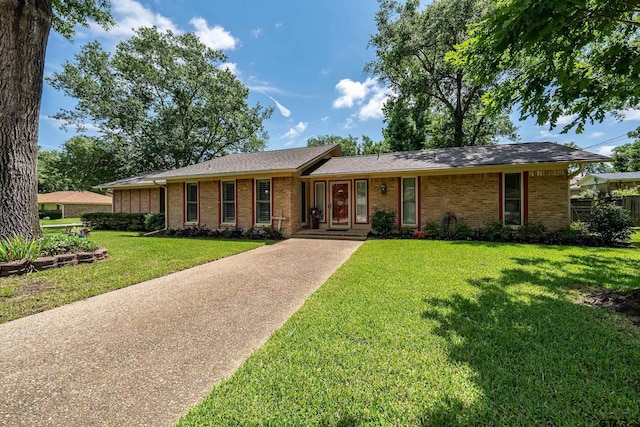 2600 Boldt Ave, Tyler, TX 75701 - ranch-style house featuring brick siding, a front lawn, and concrete driveway