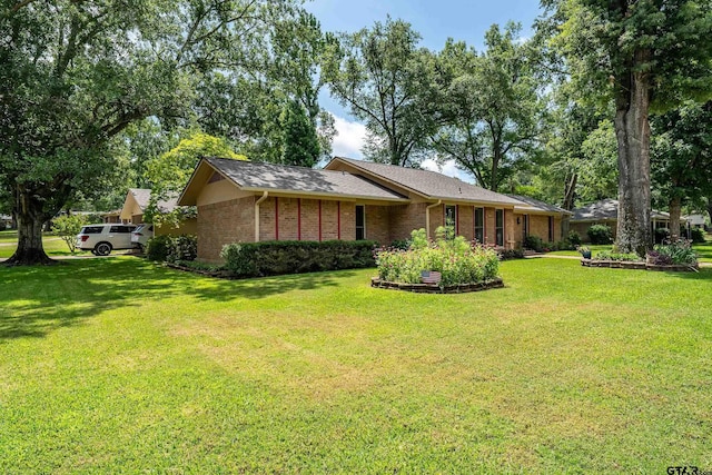 2600 Boldt Ave, Tyler, TX 75701 - view of front facade with a front yard and brick siding