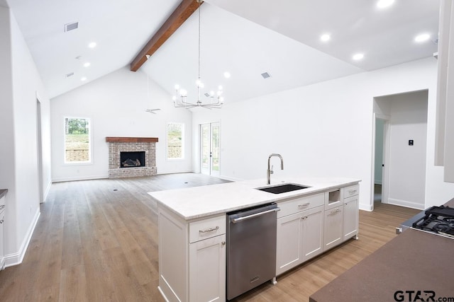 9244 Villas Ct, Tyler, TX 75703 - kitchen with dishwasher, a sink, beamed ceiling, white cabinets, and a chandelier