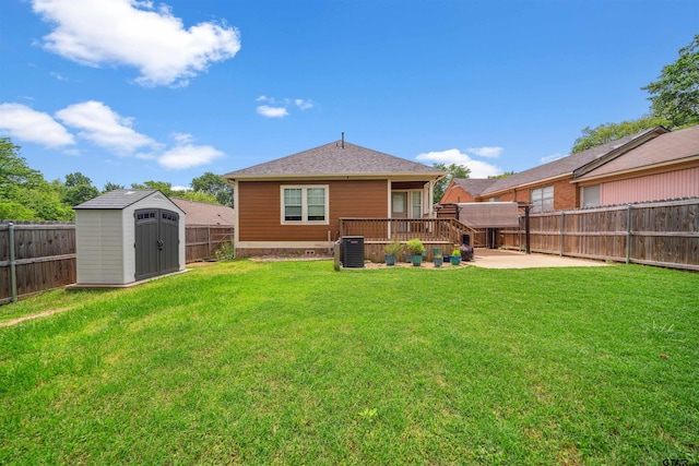 811 W 27th St, Tyler, TX 75702 - rear view of property featuring a patio, a storage shed, an outbuilding, central air condition unit, and roof with shingles