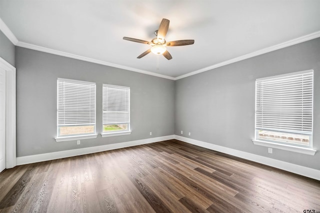 811 W 27th St, Tyler, TX 75702 - spare room with crown molding, plenty of natural light, dark wood-style floors, baseboards, and a ceiling fan