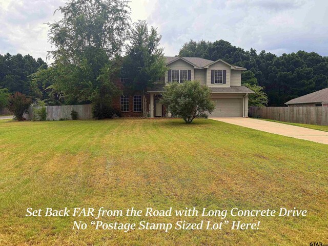 12260 Wild Horse, Tyler, TX 75706 - traditional-style house featuring driveway and an attached garage