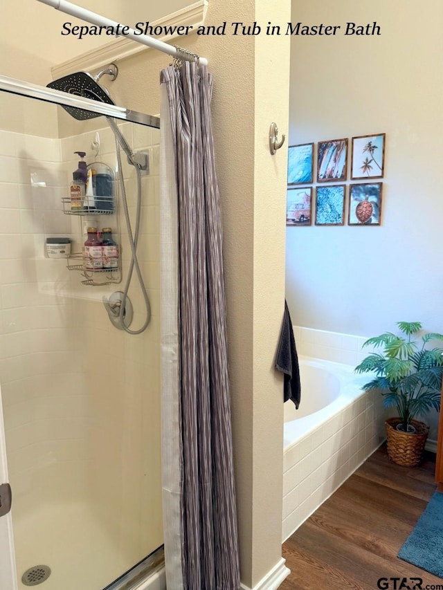 12260 Wild Horse, Tyler, TX 75706 - full bath with a stall shower, a garden tub, and wood finished floors