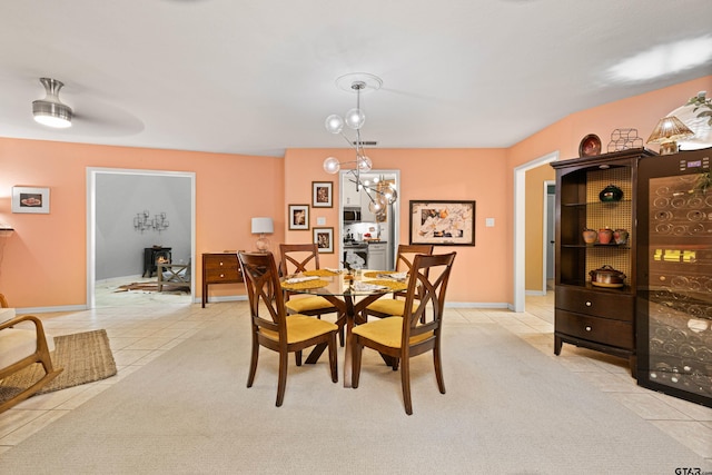 dining area with baseboards, light tile patterned flooring, and visible vents