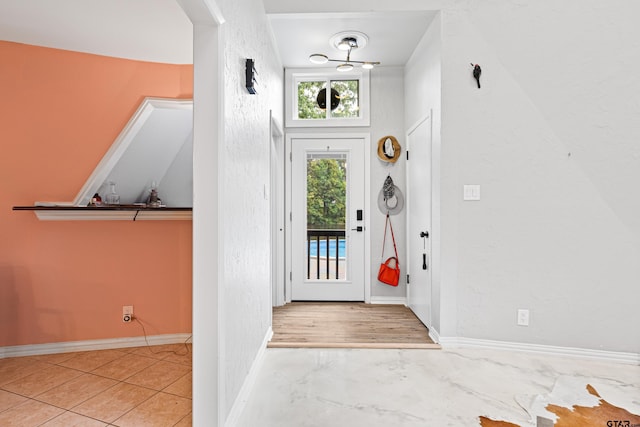 entryway featuring baseboards