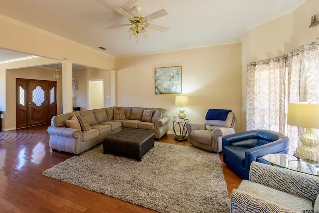 living room featuring ceiling fan, wood-type flooring, and ornamental molding