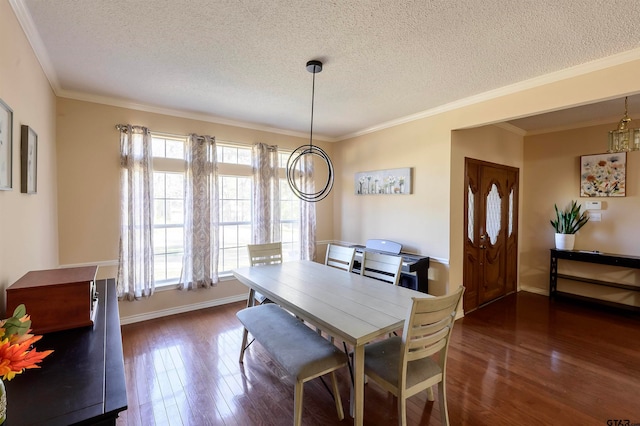 dining room featuring a healthy amount of sunlight, a textured ceiling, dark hardwood / wood-style flooring, and ornamental molding