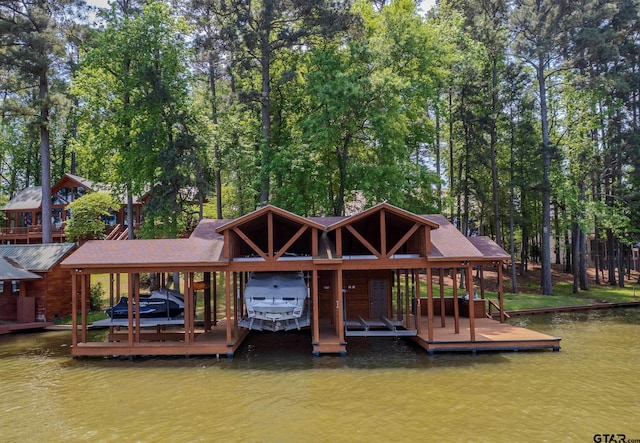 view of dock with boat lift and a water view