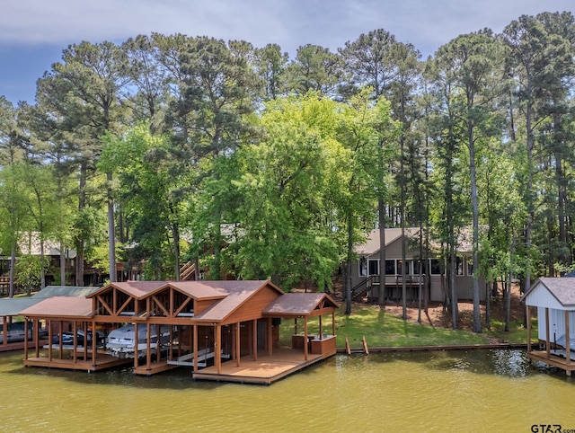 view of dock featuring boat lift and a water view