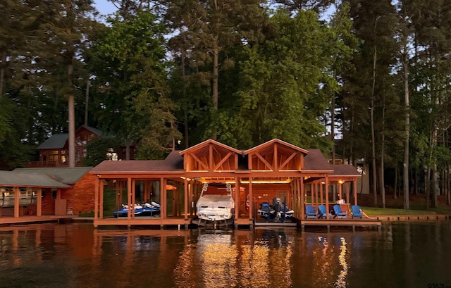 view of dock featuring a water view and boat lift