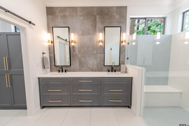 full bath with tile patterned flooring, walk in shower, a sink, and double vanity
