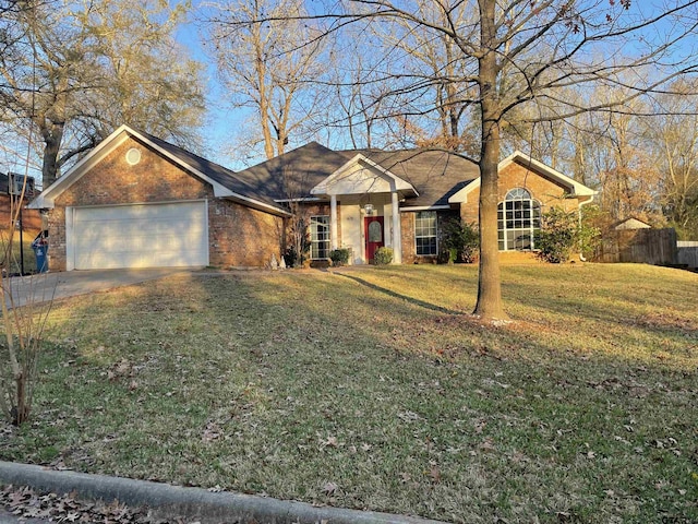 single story home featuring a front yard and a garage