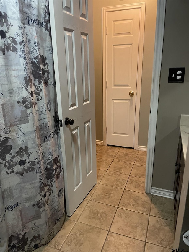 bathroom with tile patterned floors