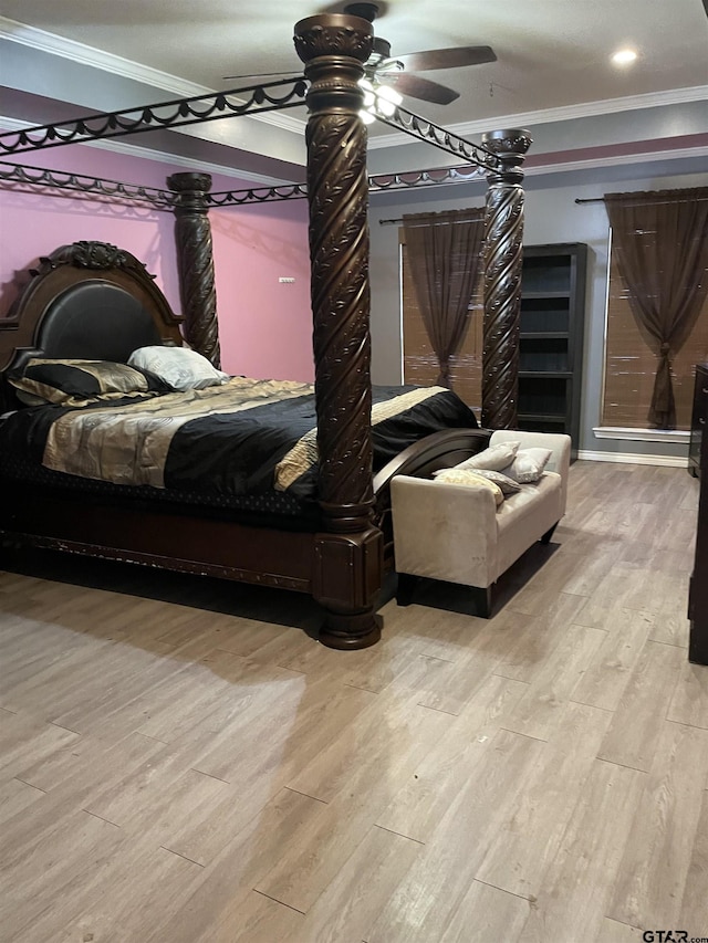 bedroom with light hardwood / wood-style floors, ceiling fan, and ornamental molding