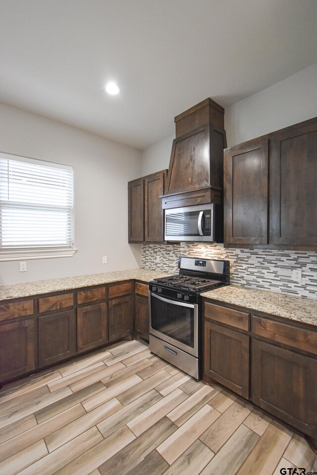 bonus room featuring dark colored carpet and lofted ceiling