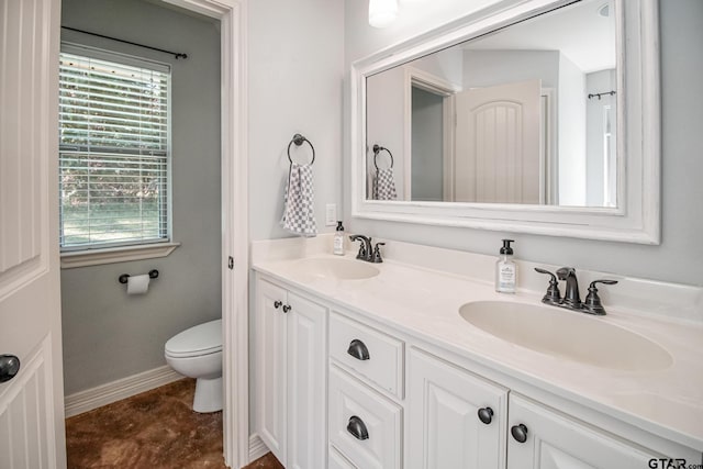 18424 Whipporwill, Flint, TX 75762 - full bath with double vanity, toilet, and baseboards