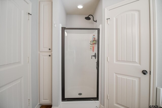 18424 Whipporwill, Flint, TX 75762 - full bath featuring a stall shower and baseboards