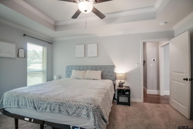 18424 Whipporwill, Flint, TX 75762 - carpeted bedroom with a tray ceiling, crown molding, a ceiling fan, and baseboards
