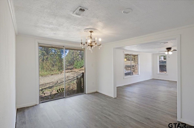 unfurnished room with hardwood / wood-style flooring, ceiling fan with notable chandelier, a textured ceiling, and crown molding