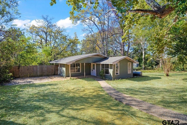 single story home with a front yard