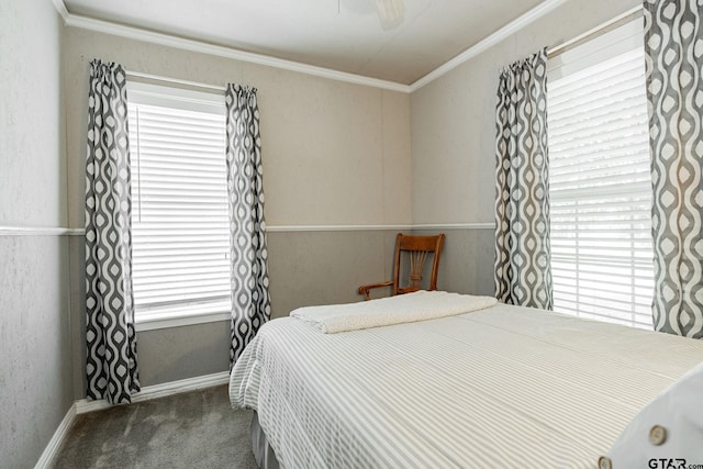 carpeted bedroom with ceiling fan and ornamental molding