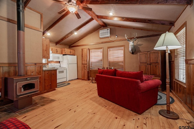 living room with wood walls, a wall mounted AC, a wood stove, vaulted ceiling with beams, and light hardwood / wood-style flooring