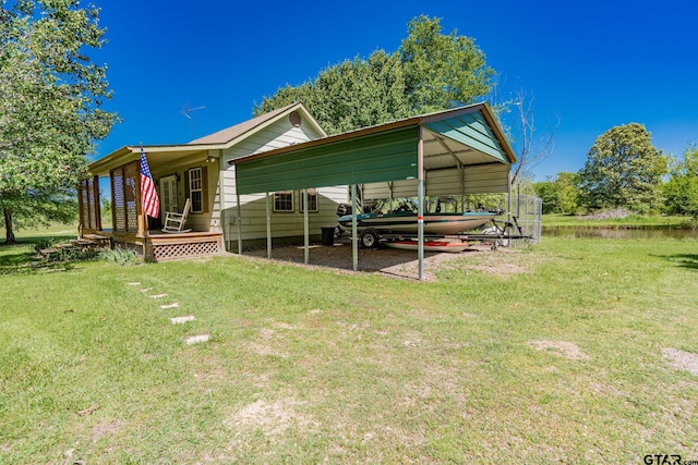 exterior space with a yard and a carport