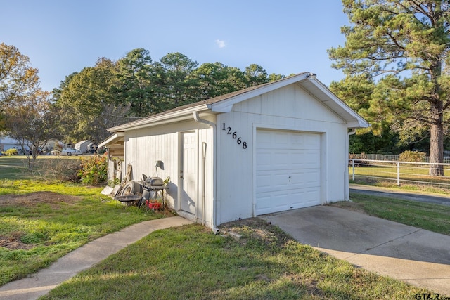 garage with a lawn