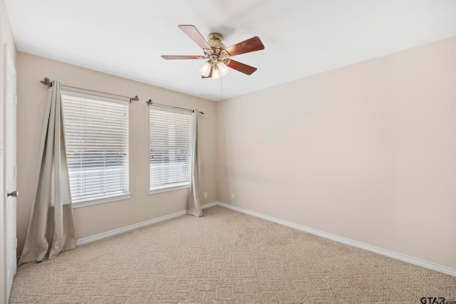 carpeted empty room featuring ceiling fan