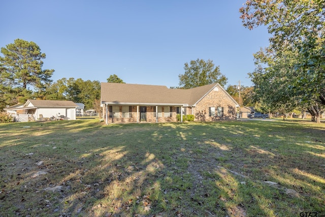 ranch-style home with a front lawn