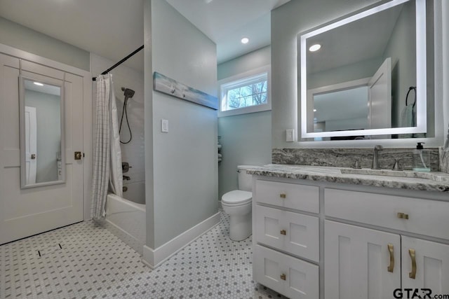 full bathroom featuring shower / bathtub combination with curtain, vanity, and toilet