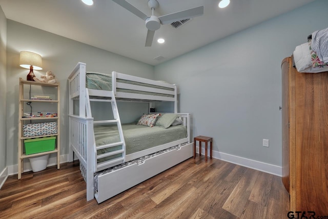 bedroom with dark wood-type flooring and ceiling fan