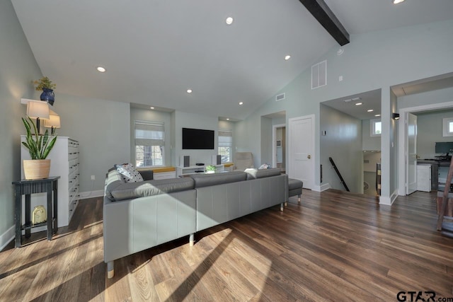 living room with high vaulted ceiling, dark hardwood / wood-style floors, and beamed ceiling